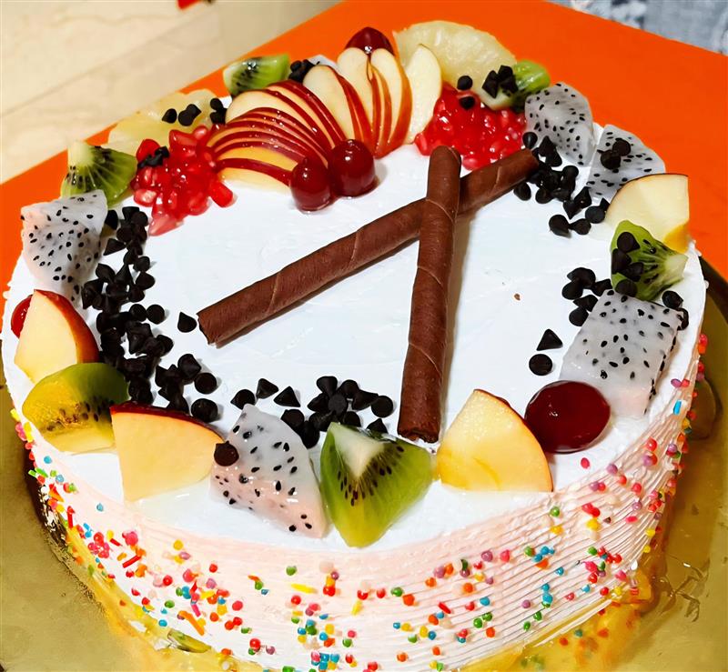 Fruit cake with fresh and dried fruits